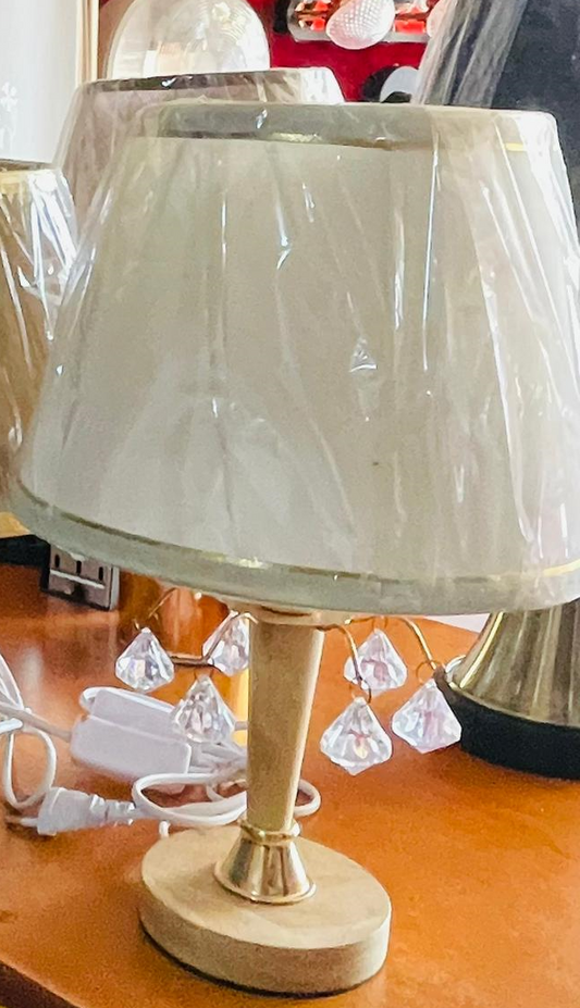Elegant crystal table lamp with gold base and decorative crystal accents for stylish lighting