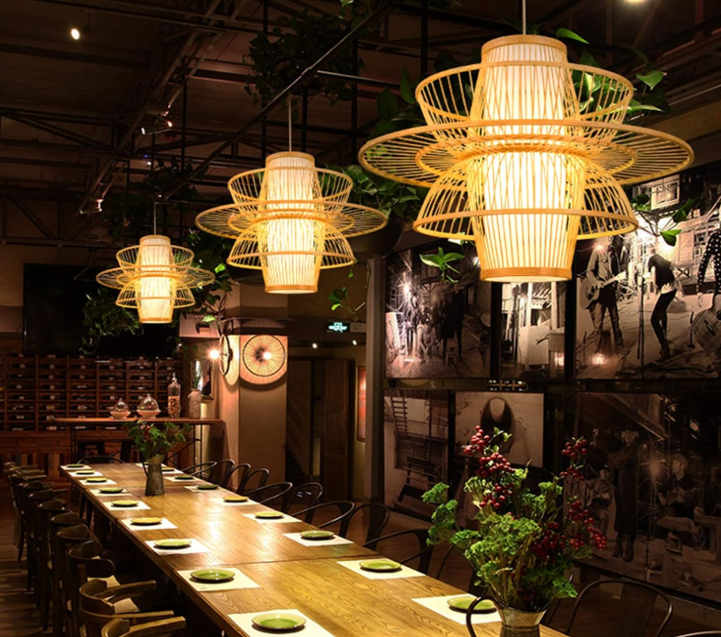 Stylish handmade bamboo pendant light illuminating a modern dining space with greenery