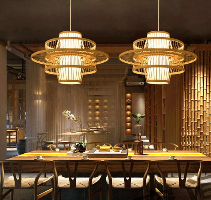 Elegant handmade bamboo pendant light illuminating a stylish dining area with wooden furniture