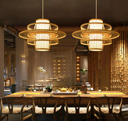Elegant handmade bamboo pendant light illuminating a stylish dining area with wooden furniture