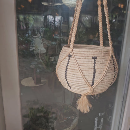 a hanging raffia basket made in rwanda