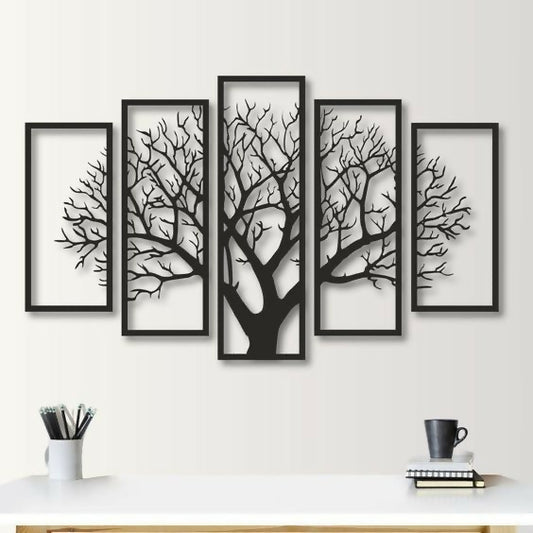 Set of five framed black tree silhouettes on a white wall.