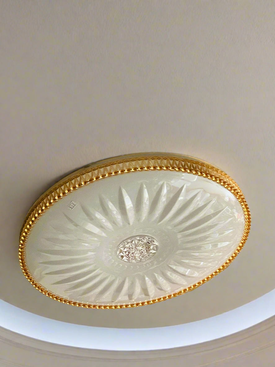 Elegant Amangazini Sunburst ceiling light with intricate design and gold accents for stylish room illumination