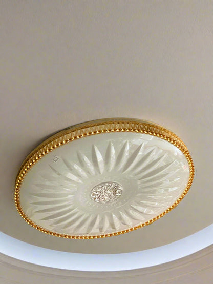 Elegant Amangazini Sunburst ceiling light with intricate design and gold accents for stylish room illumination