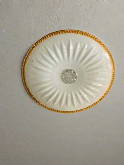 Amangazini Sunburst ceiling light with intricate design and a central crystal embellishment