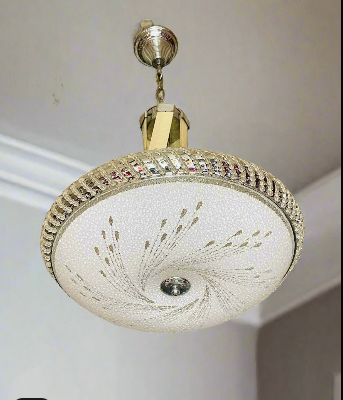 Swirl Elegance Pendant Light featuring a decorative design and metallic finish for modern interiors
