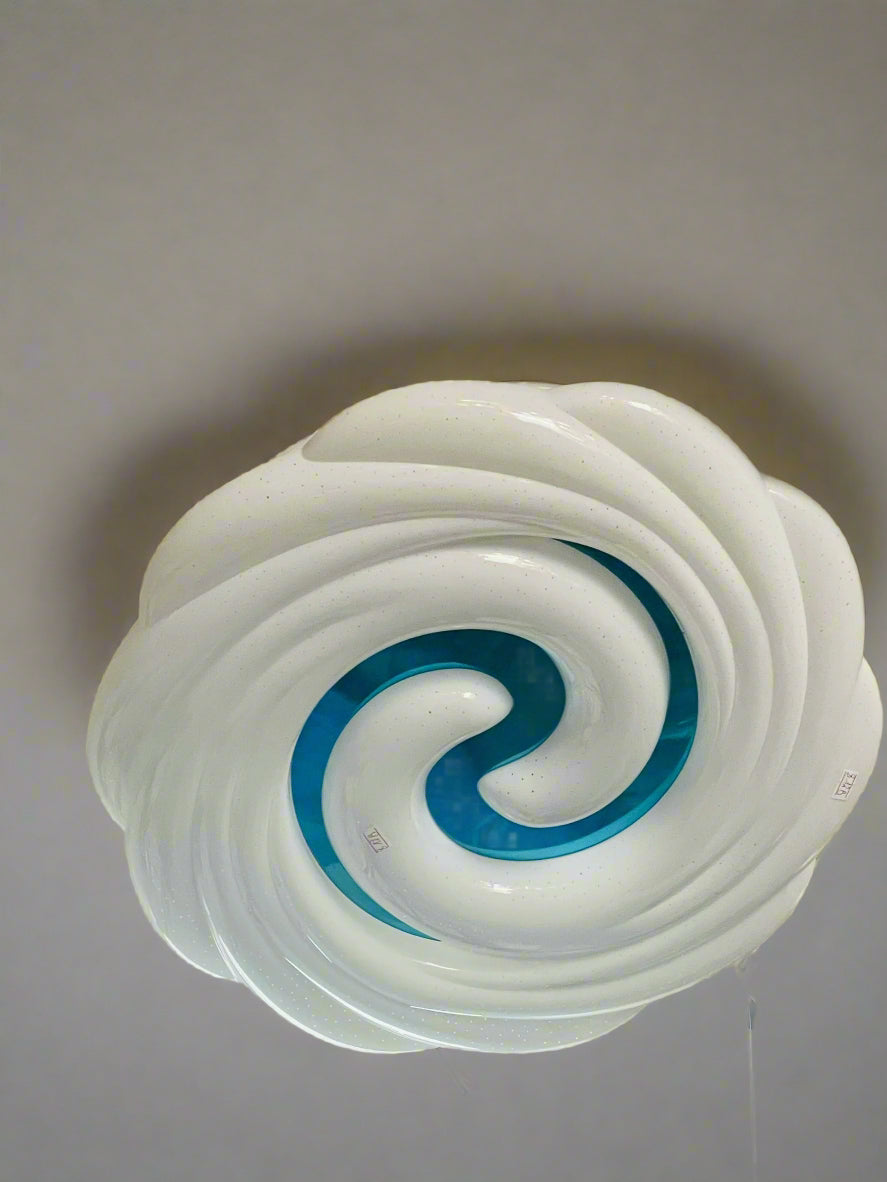 Teal swirl ceiling light featuring a modern design with smooth, wavy shades for any room