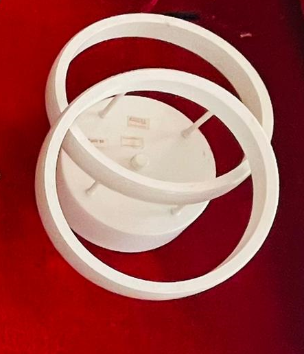 Amangazini unique circular wall lamp design featuring a modern three-ring structure in white