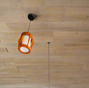 Amangazini wood ceiling pendant light with an elegant design hanging from a wooden ceiling